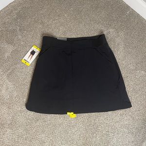 Sport skirt size small with shorts under and pockets.